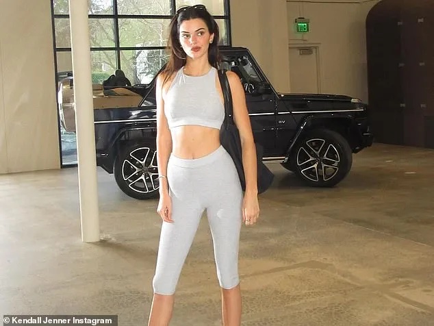 Kendall Jenner is wearing gray leggings and a sporty top in the latest photos.